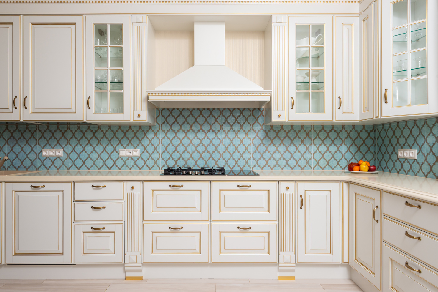 White wooden cabinets of expensive kitchen